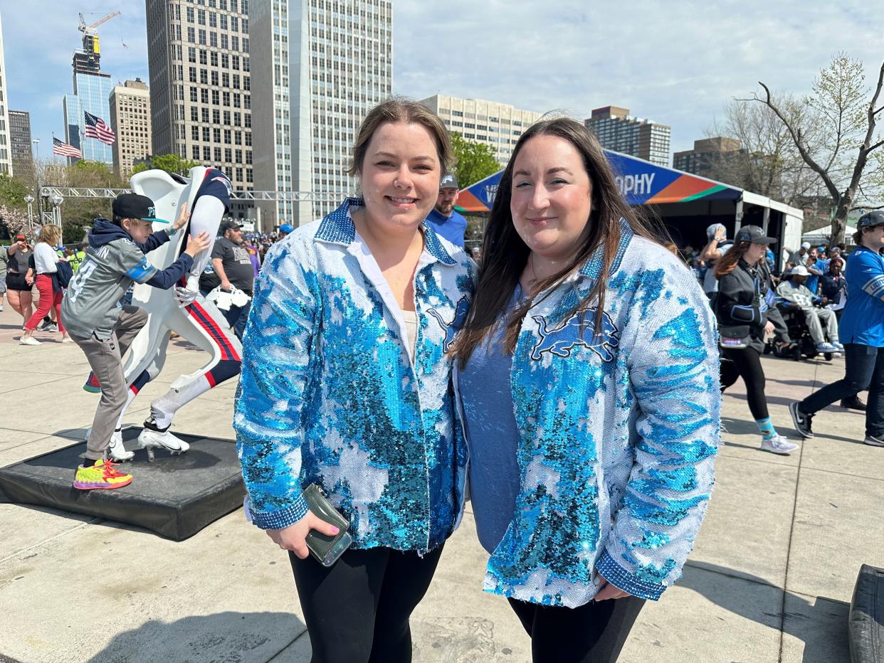 Janelle Farris, left, and Chelsea Hewitt don the shiny Detroit Lions-themed jackets they made for the NFL draft on April 27, 2024 in downtown Detroit.