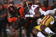 Oregon State running back Jam Griffin is brought down by Southern California defensive back Max Williams during the first half of an NCAA college football game Saturday, Sept. 24, 2022, in Corvallis, Ore. (AP Photo/Amanda Loman)