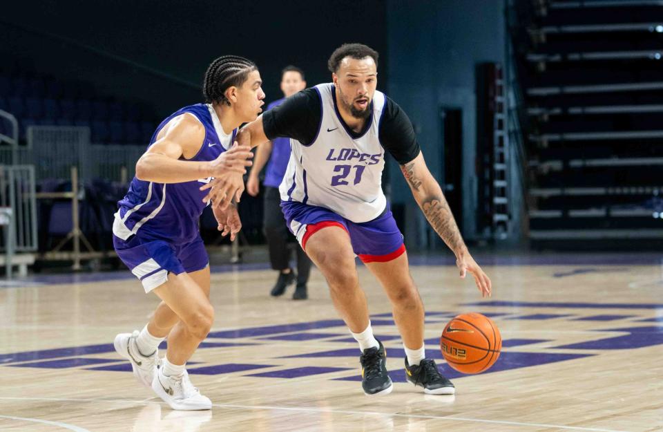 Sep 27, 2024; Phoenix, Ariz., U.S.; Grand Canyon Lopes Forward JaKobe Coles (21) runs with the ball against Guard Styles Phipps (1) during practice at Grand Canyon University Arena in Phoenix on Sept. 27, 2024.