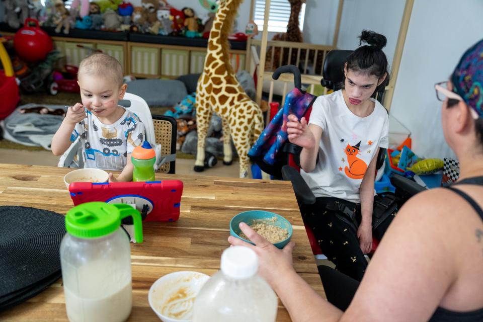 Tobias, 3, and Sophie, 14, at home with mom.