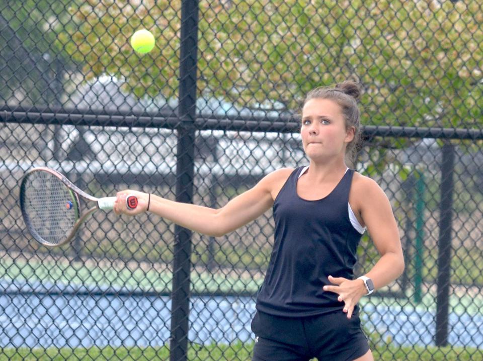 West Ottawa's Grace Gaul returns a shot during the Division 1 regional tournament.