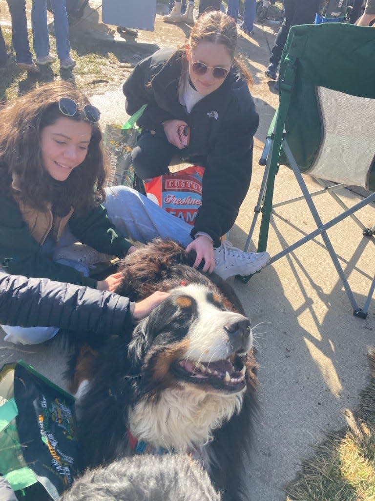 Michigan State University students visit a Monroe-area service dog.