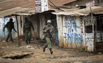 <p>Riot police chase after protesters during clashes in the Kawangware area of Nairobi, Kenya Thursday, Aug. 10, 2017. (Photo: Ben Curtis/AP) </p>