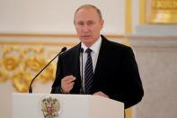 Russian President Vladimir Putin delivers a speech during the awarding ceremony for Russian Olympic medallists returning home from the 2016 Rio Olympics, at the Kremlin in Moscow, Russia August 25, 2016. REUTERS/Maxim Shemetov