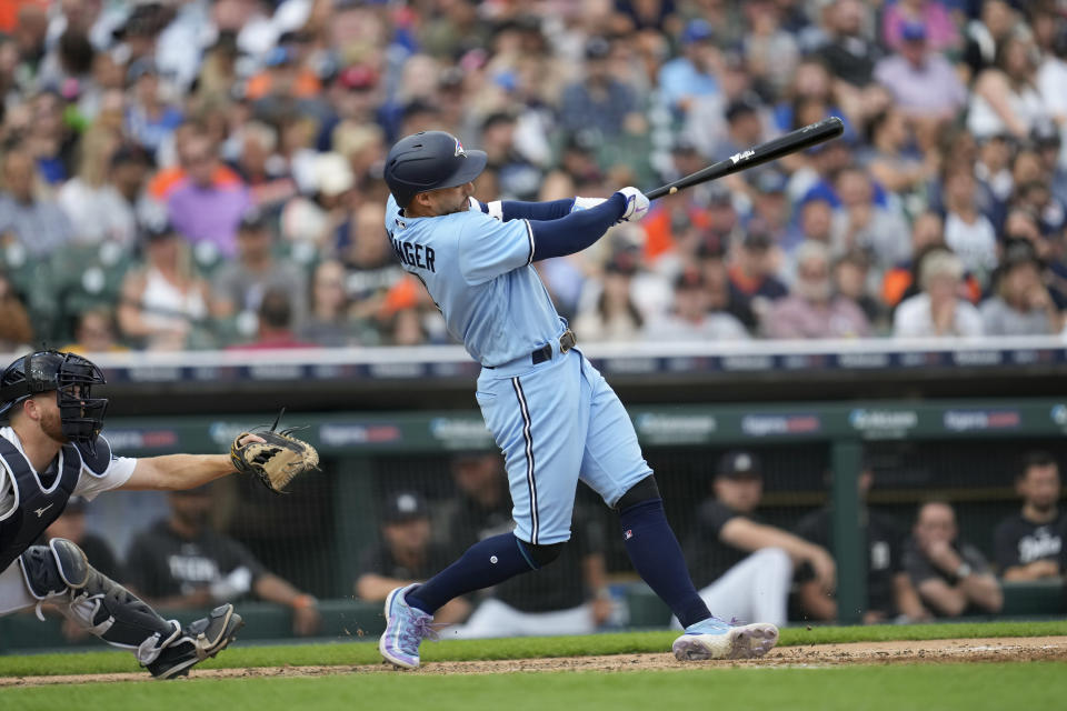 Toronto Blue Jays' George Springer hits a two-run home run against the Detroit Tigers in the fourth inning of a baseball game, Friday, July 7, 2023, in Detroit. (AP Photo/Paul Sancya)