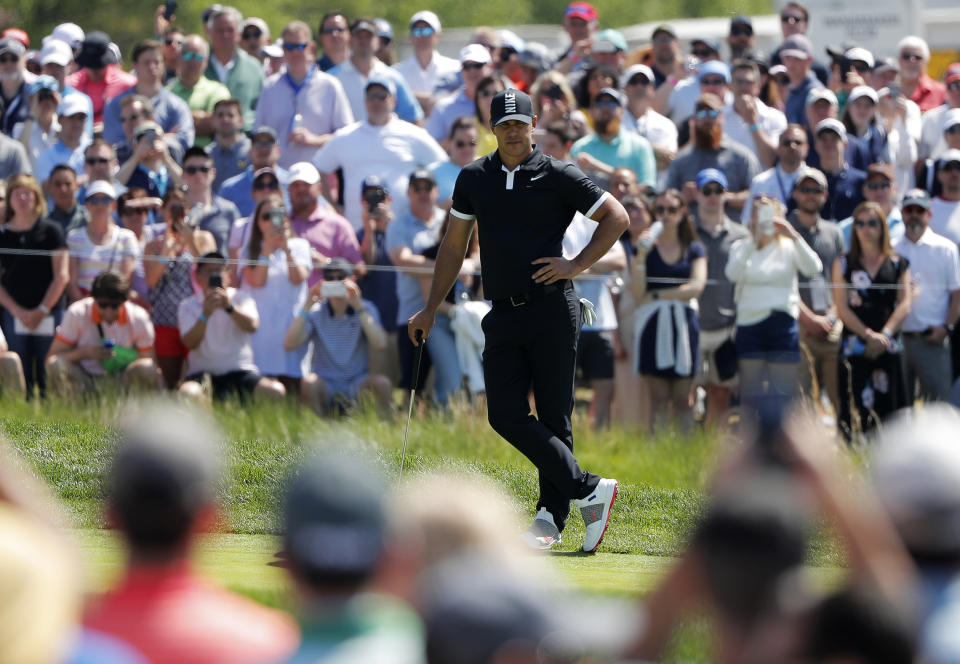 Brooks Koepka waits to putt on the first green during the third round of the PGA Championship golf tournament, Saturday, May 18, 2019, at Bethpage Black in Farmingdale, N.Y. (AP Photo/Andres Kudacki)