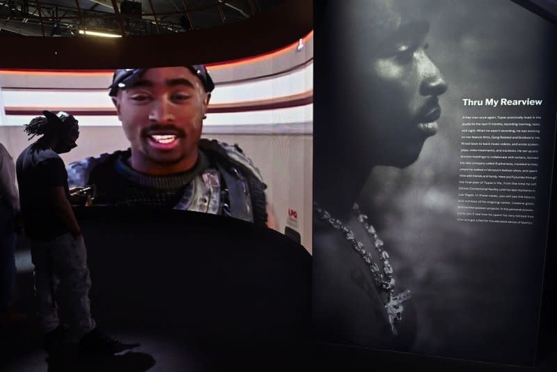 Images of Tupac Shakur are on display at The Canvas at LA Live in Los Angeles on January 23, 2022. On Friday, Las Vegas police announced the arrest of a man suspected of participating in the shooting death of Shakur. File Photo by Jim Ruymen/UPI