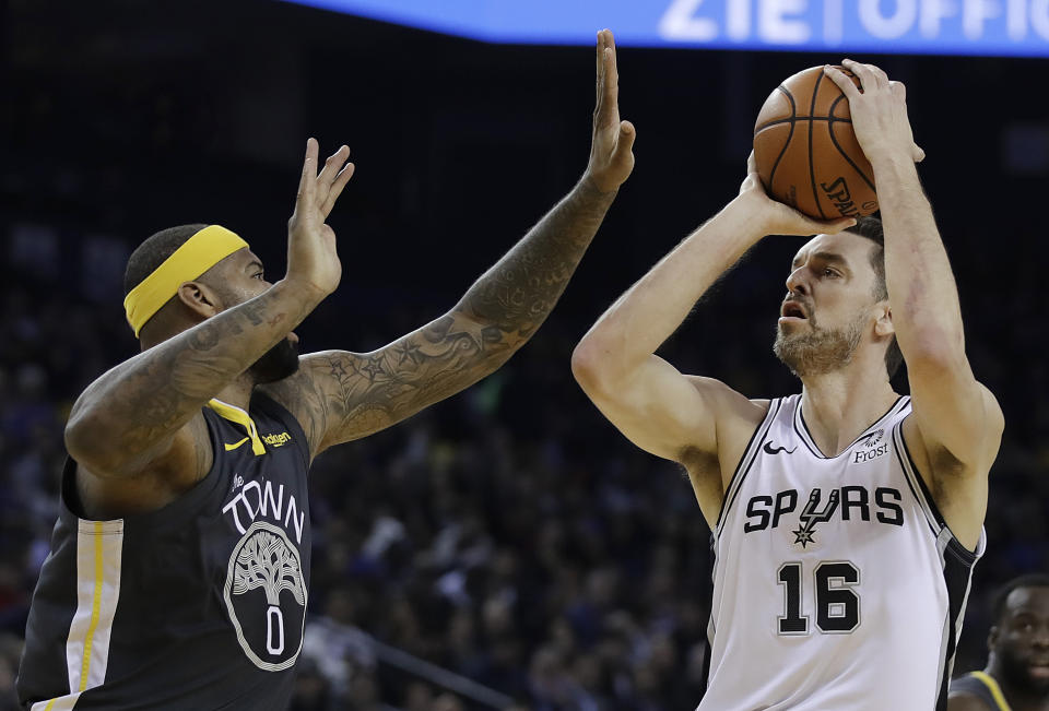 San Antonio Spurs' Pau Gasol (16) shoots against Golden State Warriors' DeMarcus Cousins during the first half of an NBA basketball game Wednesday, Feb. 6, 2019, in Oakland, Calif. (AP Photo/Ben Margot)