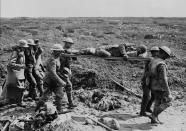 <p>Aid workers and German prisoners help transport wounded soldiers from Vimy Ridge in April 1917. Photo from CP. </p>