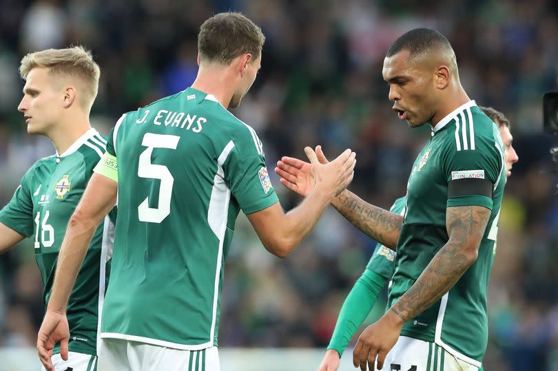 A picture of Josh Magennis and Jonny Evans