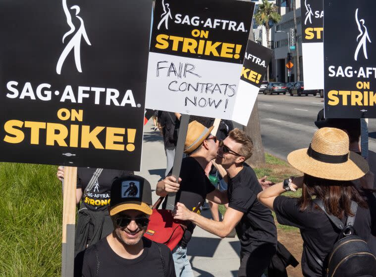 LOS ANGELES, CA - JULY 14: SAG-AFTRA members take to the picket line outside Netflix in Los Angeles, CA on Friday, July 14, 2023. Actors join striking writers who have been on the picket lines since the beginning of May. (Myung J. Chun / Los Angeles Times)