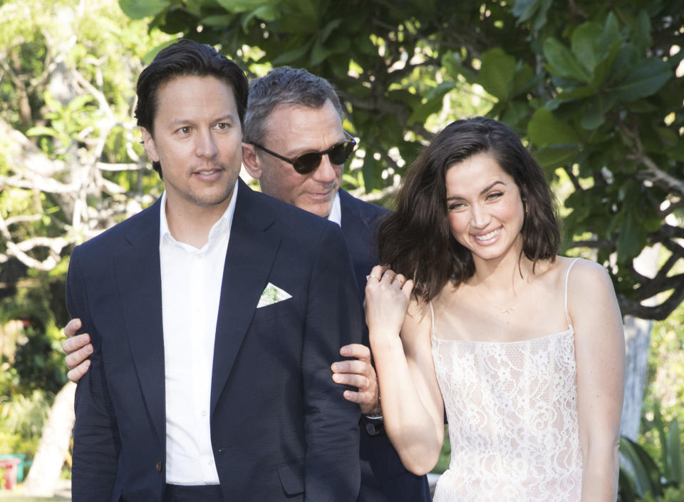 Director Cary Joji Fukunaga, from left, actors Daniel Craig and Ana de Armas pose for photographers during the photo call of the latest installment of the James Bond film franchise, currently known as 'Bond 25', in Oracabessa, Jamaica, Thursday, April 25, 2019. (AP Photo/Leo Hudson)