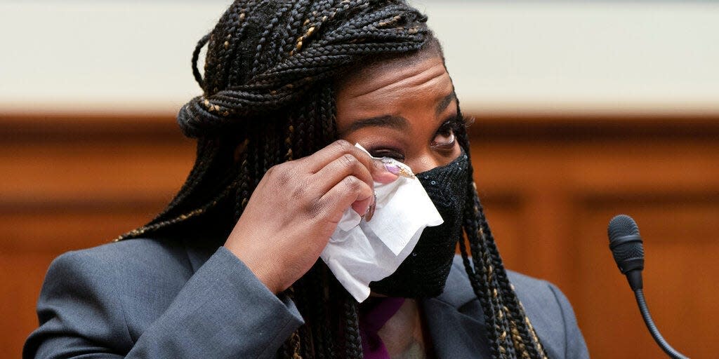 Rep. Cori Bush, D-Mo., wipes away a tear as she prepares to testify about her experience being raped and a subsequent abortion, Thursday, Sept. 30, 2021, during a House Committee on Oversight and Reform hearing on Capitol Hill in Washington.