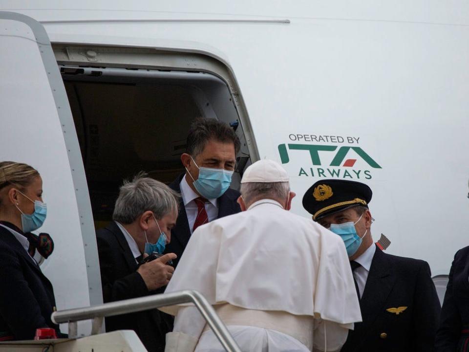 Pope Francis boards an ITA plane.