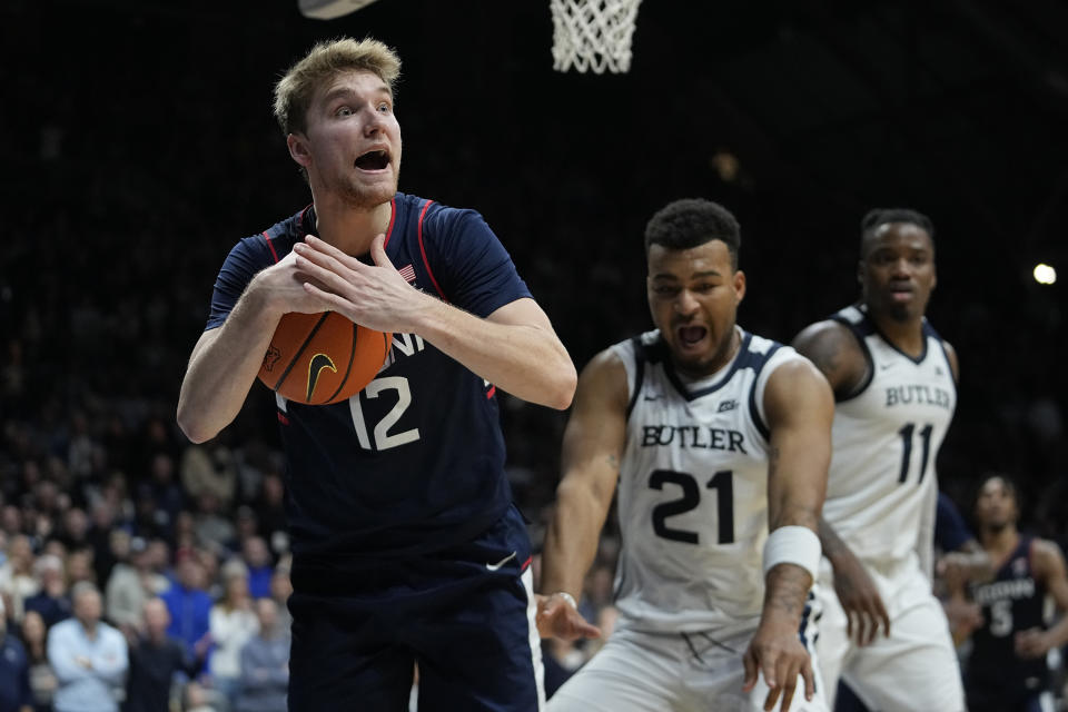 UConn's Cam Spencer (12) calls a timeout during the second half of an NCAA college basketball game against Butler, Friday, Jan. 5, 2024, in Indianapolis. (AP Photo/Darron Cummings)