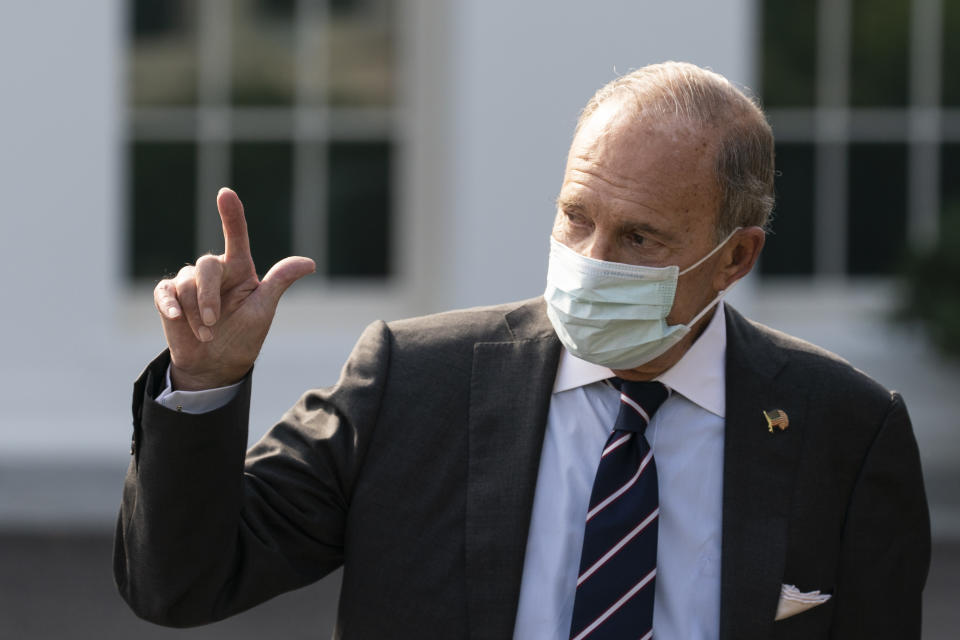 White House chief economic adviser Larry Kudlow gestures as he walks to a television interview at the White House, Thursday, Oct. 22, 2020, in Washington. (AP Photo/Alex Brandon)