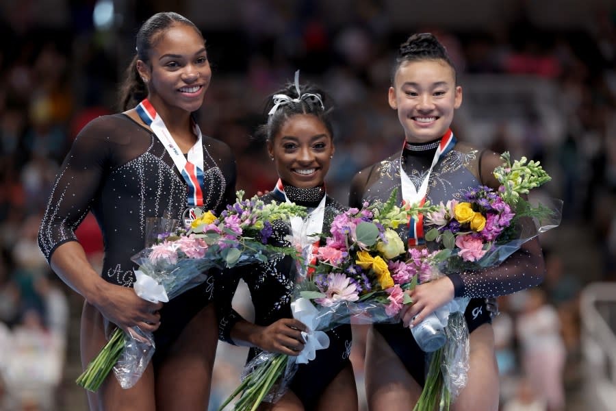 Shi Jones, Simone Biles, and Leanne Wong pose for photos after placing second, first, and third in the all-around competition on day four of the 2023 U.S. Gymnastics Championships at SAP Center on August 27, 2023 in San Jose, California. (Photo by Ezra Shaw/Getty Images)