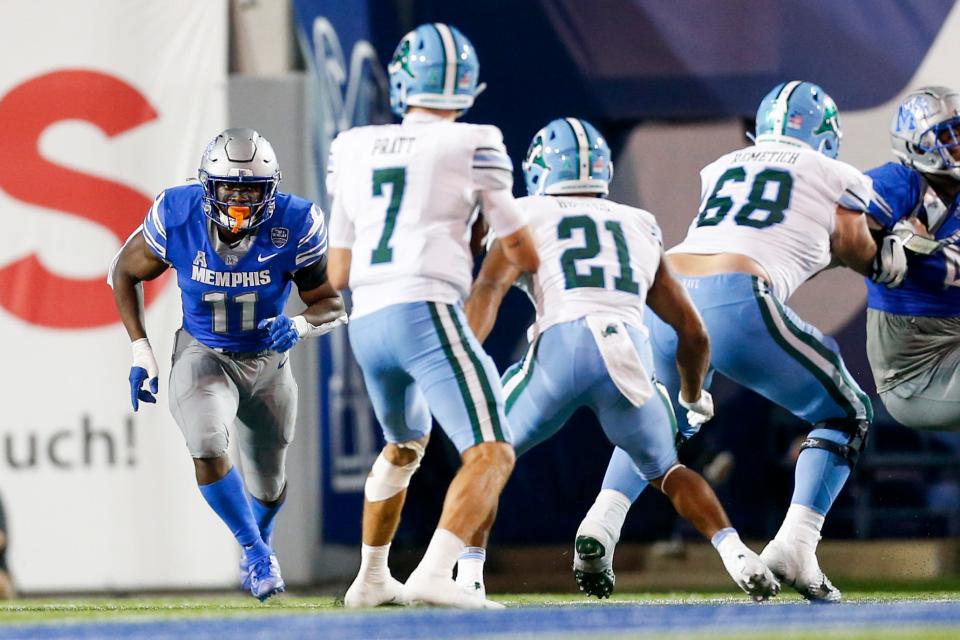 Memphis' Chandler Martin (11) runs towards Tulane's Michael Pratt (7) during the game between the University of Memphis and Tulane University at Simmons Bank Liberty Stadium before the game in Memphis, Tenn., on Friday, October 13, 2023.