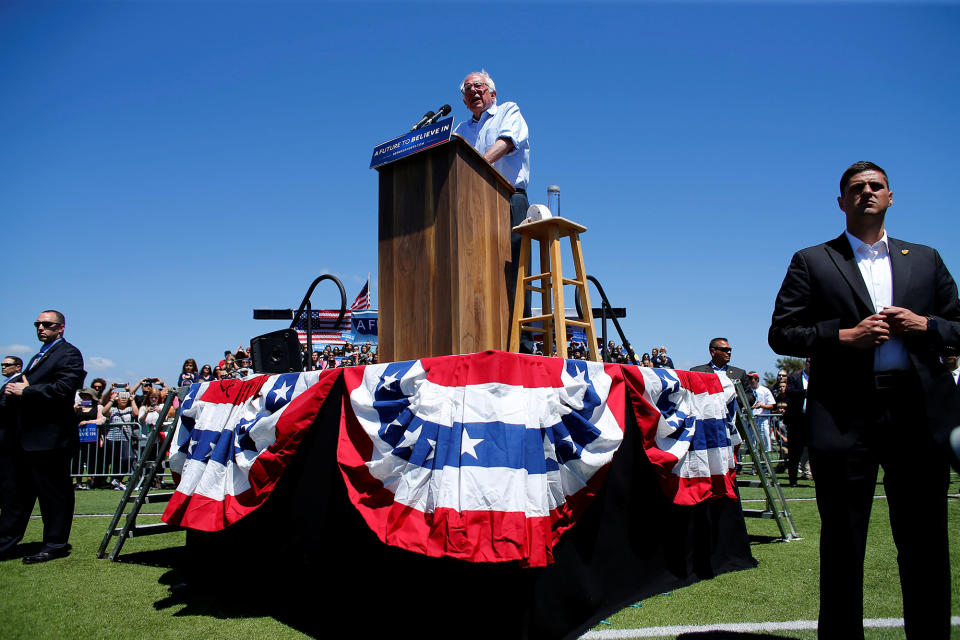 <p>Surrounded by secret service agents U.S. Democratic presidential candidate Bernie Sanders speaks at a rally in Vista, California, United States, May 22, 2016. (REUTERS/Mike Blake) </p>