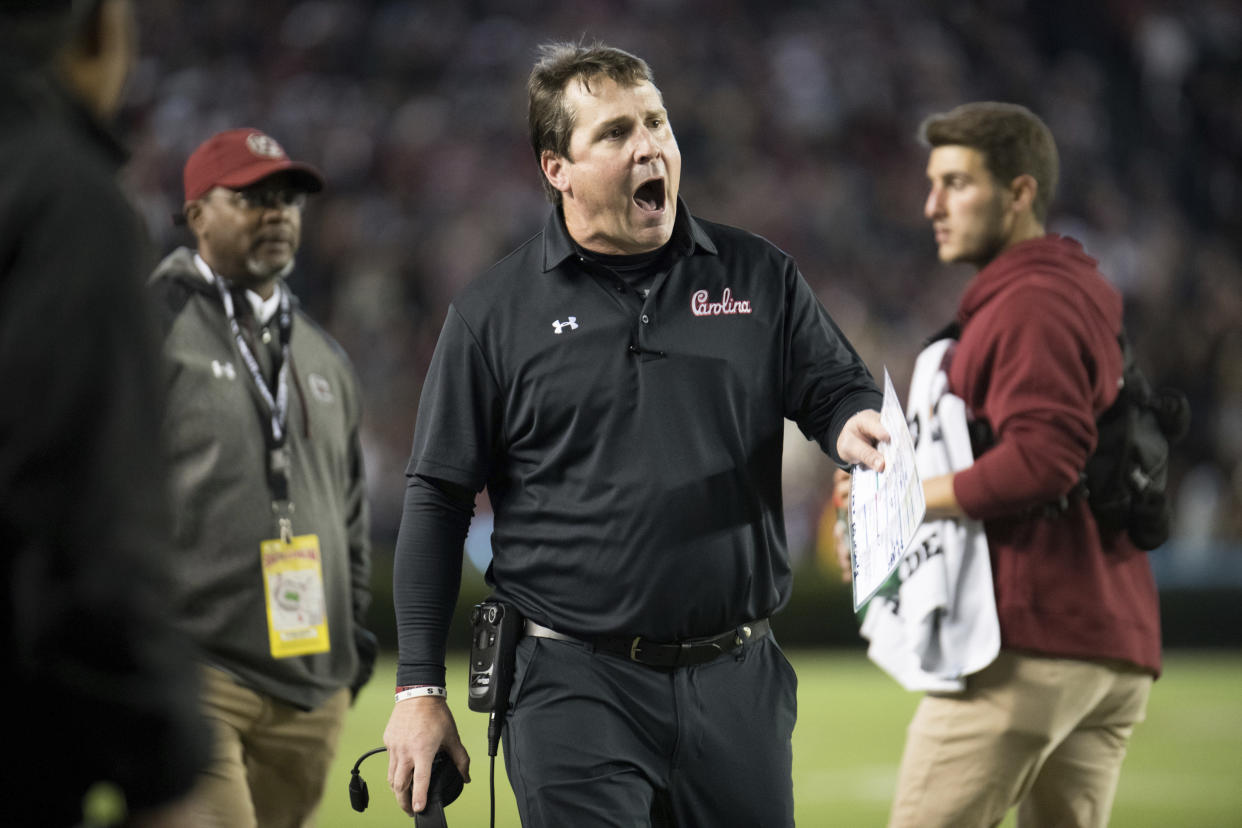 South Carolina head coach Will Muschamp, center, shouts at an official during the second half of an NCAA college football game against Tennessee, Saturday, Oct. 27, 2018, in Columbia, S.C. (AP Photo/Sean Rayford)