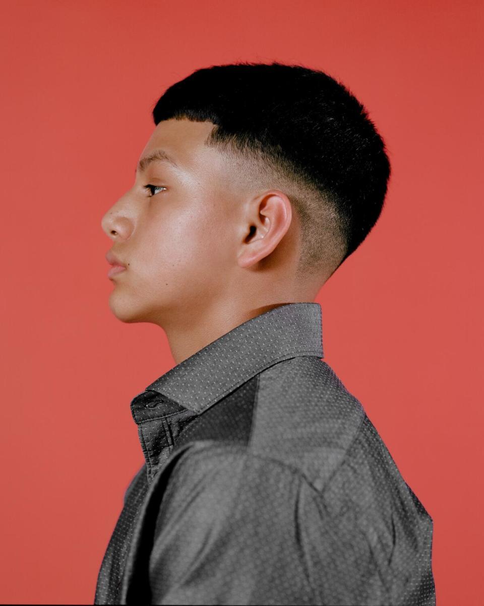 Profile image of a boy wearing an Edgar haircut.