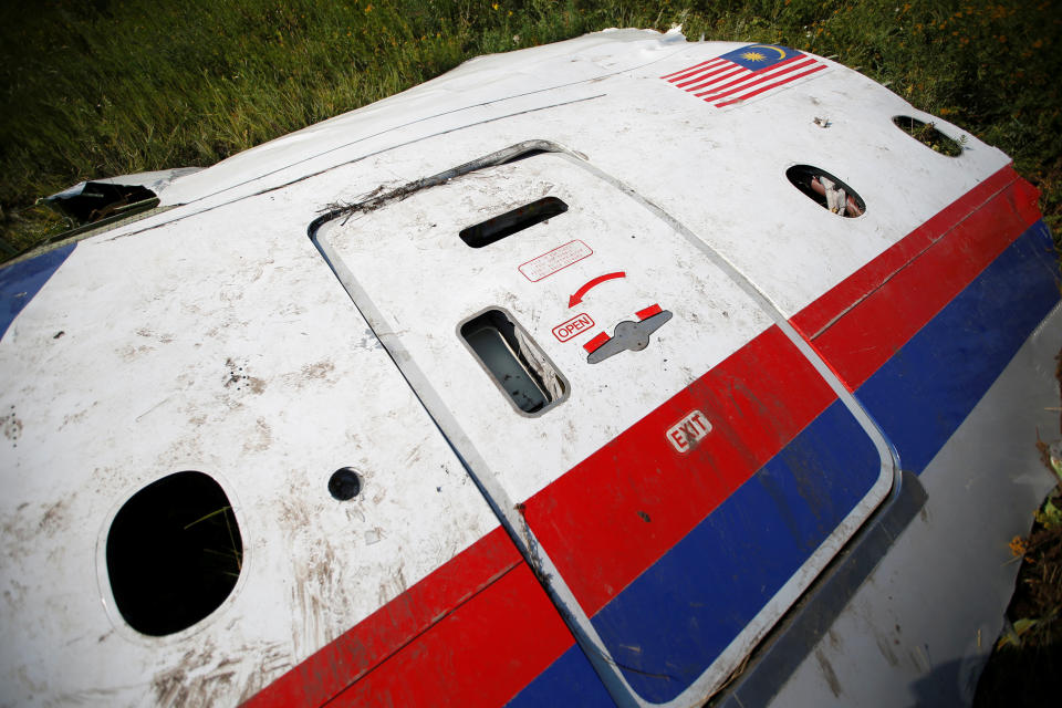 A piece of the wreckage is seen at a crash site of the Malaysia Airlines Flight MH17 near the village of Petropavlivka (Petropavlovka), Donetsk region July 24, 2014.  The Dutch are due to announce on Wednesday 28 September the long-awaited results of an investigation with Australia, Malaysia, Belgium and Ukraine into the July 17, 2014 downing of the flight.   REUTERS/Maxim Zmeyev/File Photo          FROM THE FILES PACKAGE - SEARCH "FILES MH17" FOR ALL 20 IMAGES