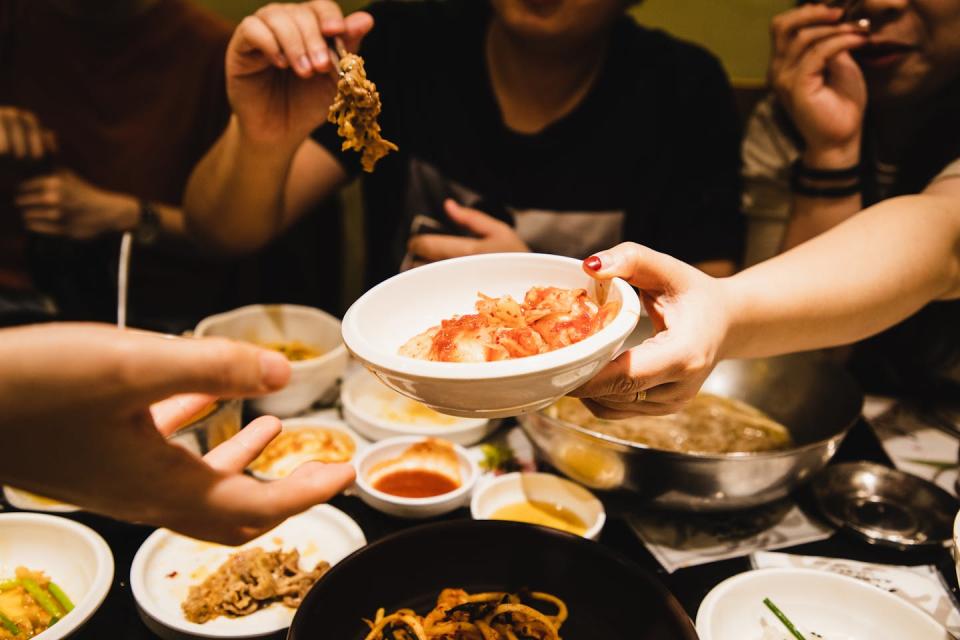 Making and sharing fermented foods can bring people together. <a href="https://www.gettyimages.com/detail/photo/friends-sharing-korean-food-together-royalty-free-image/1271661216" rel="nofollow noopener" target="_blank" data-ylk="slk:Kilito Chan/Moment via Getty Images;elm:context_link;itc:0;sec:content-canvas" class="link ">Kilito Chan/Moment via Getty Images</a>