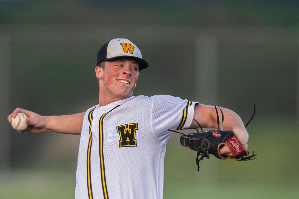 Winterset's Justin Hackett throws a pitch against Carroll on Tuesday at Winterset High School.