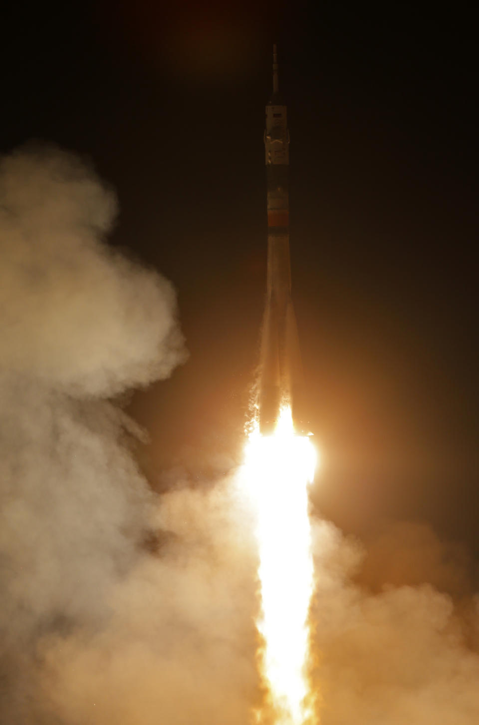 The Soyuz-FG rocket booster with Soyuz TMA-12M space ship carrying a new crew to the International Space Station (ISS) blasts off at the Russian leased Baikonur cosmodrome, Kazakhstan, Wednesday, March 26, 2014. The Russian rocket carries astronaut Steven Swanson, Russian cosmonauts Alexander Skvortsov and Oleg Artemyev. (AP Photo/Dmitry Lovetsky)