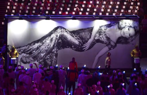 A giant tarpaulin depicting British model Kate Moss crosses the Olympic stadium during the closing ceremony of the 2012 London Olympic Games in London