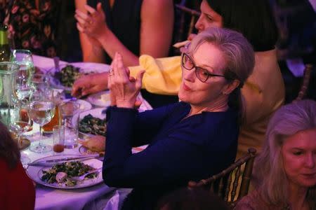 Actor Meryl Streep applauds as she listens to former U.S. Secretary of State Hillary Clinton speak at the Women for Women International Luncheon in New York, U.S., May 2, 2017. REUTERS/Brendan McDermid