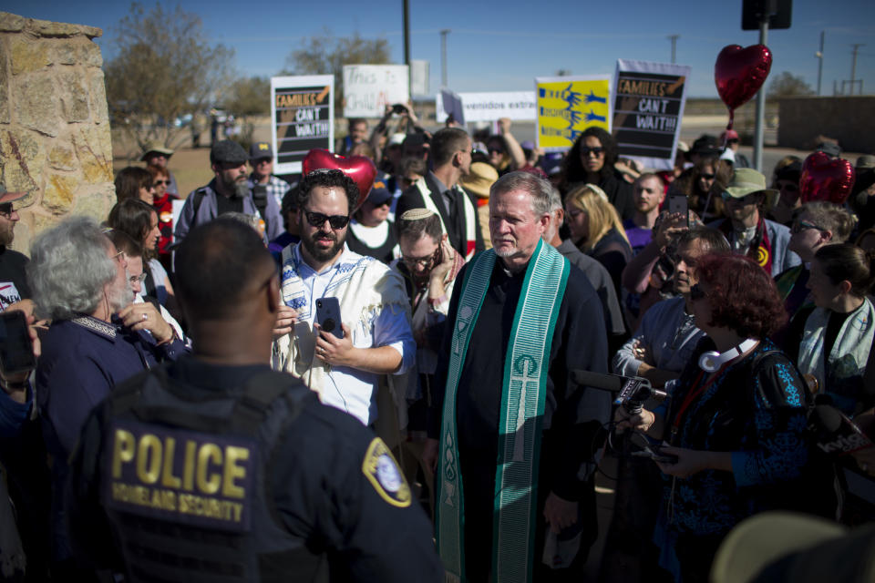 In this Nov. 15, 2018 photo provided by Ivan Pierre Aguirre, rabbis and other faith leaders talk with a Department of Homeland Security official outside the Tornillo detention camp holding more than 2,300 migrant teens in Tornillo, Texas. The Trump administration announced in June 2018 that it would open the temporary shelter for up to 360 migrant children in this isolated corner of the Texas desert. Less than six months later, the facility has expanded into a detention camp holding thousands of teenagers - and it shows every sign of becoming more permanent. (Ivan Pierre Aguirre via AP)