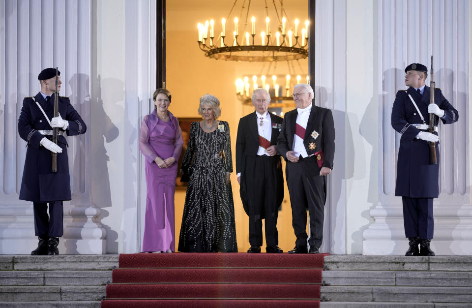 FILE - German President Frank-Walter Steinmeier, right, his wife Elke Buedenbender, left, Britain's King Charles III, 2nd right, and Camilla, the Queen Consort, stand in front of the Bellevue Palace in Berlin, Wednesday, March 29, 2023. King Charles III won plenty of hearts during his three-day visit to Germany, his first foreign trip since becoming king following the death of his mother, Elizabeth II, last year. (AP Photo/Markus Schreiber, File)