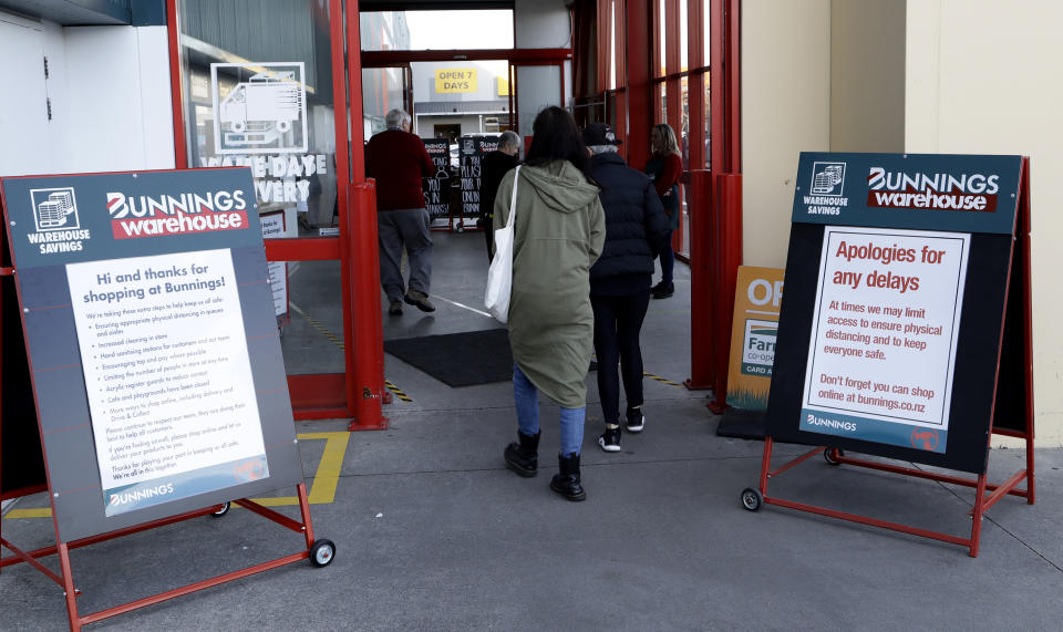 Customers enter a hardware store in Christchurch, New Zealand, Thursday, May 14, 2020. New Zealand lifted most of its remaining lockdown restrictions from midnight Wednesday as the country prepares for a new normal. Malls, retail stores and restaurants are all reopening Thursday in the South Pacific nation of 5 million, and many people are returning to their workplaces. (AP Photo/Mark Baker)