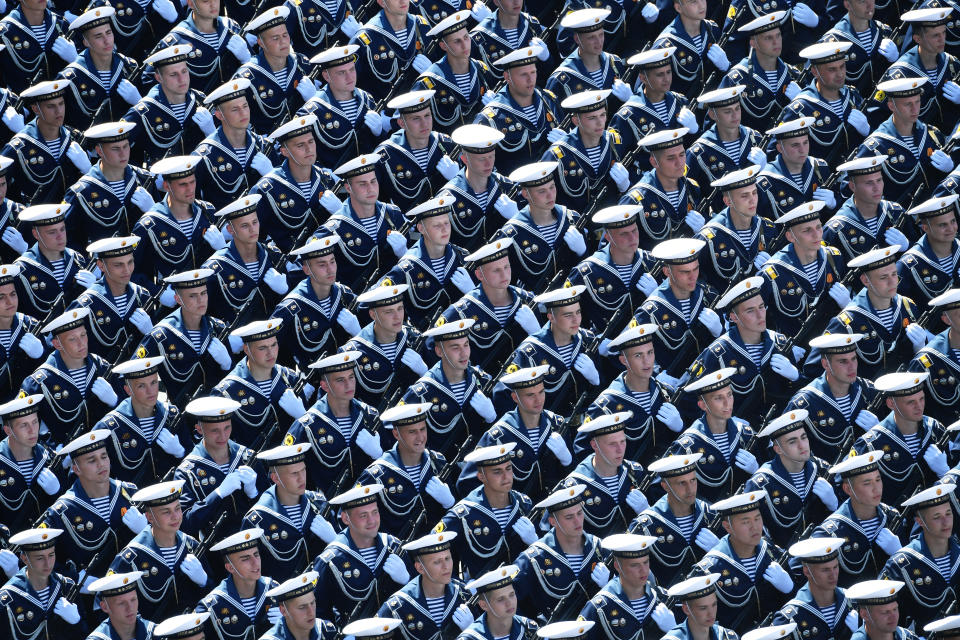 Russian sailors march toward Red Square during the Victory Day military parade marking the 75th anniversary of the Nazi defeat in Moscow, Russia, Wednesday, June 24, 2020. The Victory Day parade normally is held on May 9, the nation's most important secular holiday, but this year it was postponed due to the coronavirus pandemic. (Mikhail Voskresenskiy, Host Photo Agency via AP)