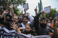 Activists of Peoples Democratic Party shout slogans during a protest marking the second anniversary of Indian government scrapping Kashmir’s semi- autonomy in Jammu, India, Thursday, Aug.5, 2021. On Aug. 5, 2019, Indian government passed legislation in Parliament that stripped Jammu and Kashmir’s statehood, scrapped its separate constitution and removed inherited protections on land and jobs. (AP Photo/Channi Anand)