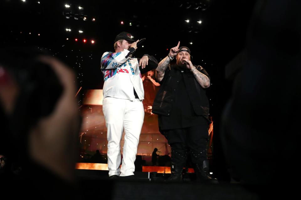 Ernest, left, joins Jelly Roll on the Mane Stage during Stagecoach in Indio, Calif., on Friday, April 26, 2024.