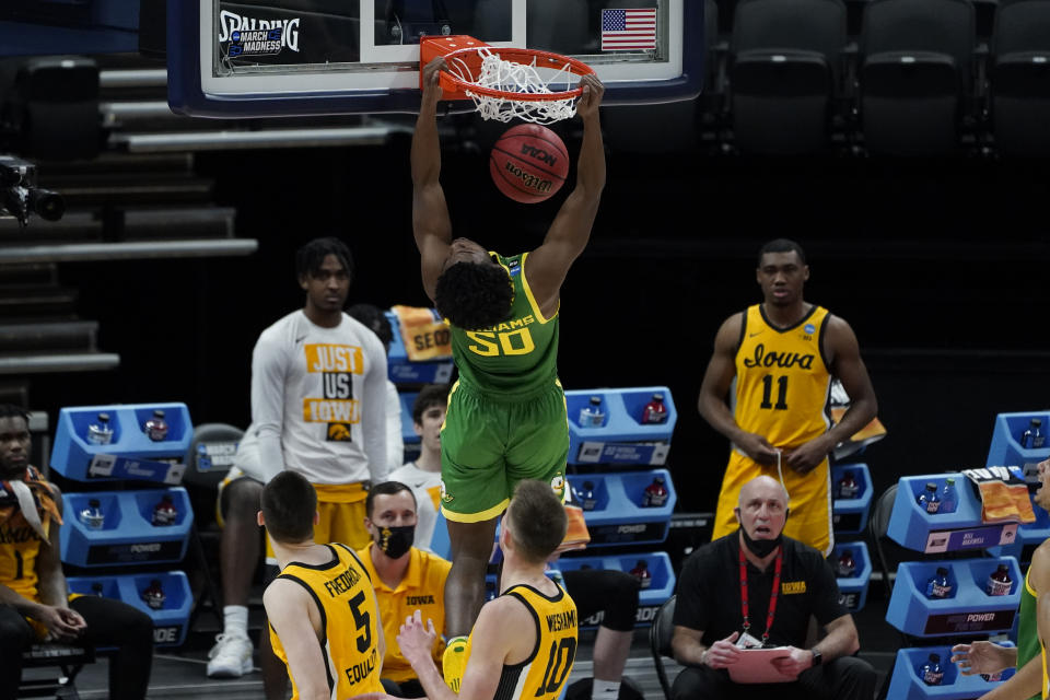 Oregon forward Eric Williams Jr. (50) dunks against Iowa during the first half of a men's college basketball game in the second round of the NCAA tournament at Bankers Life Fieldhouse in Indianapolis, Monday, March 22, 2021. (AP Photo/Paul Sancya)