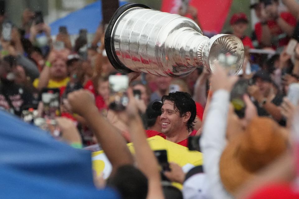 Jun 30, 2024; Fort Lauderdale, Florida, USA; Florida Panthers center Carter Verhaeghe (23) brings the Stanley Cup to the stage during the victory parade and celebration. Mandatory Credit: Jim Rassol-USA TODAY Sports