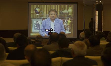 Former Pakistani president Pervez Musharraf is seen during a pre-recorded video statement played for his supporters and members of the media in Islamabad December 31, 2013. REUTERS/Mian Khursheed