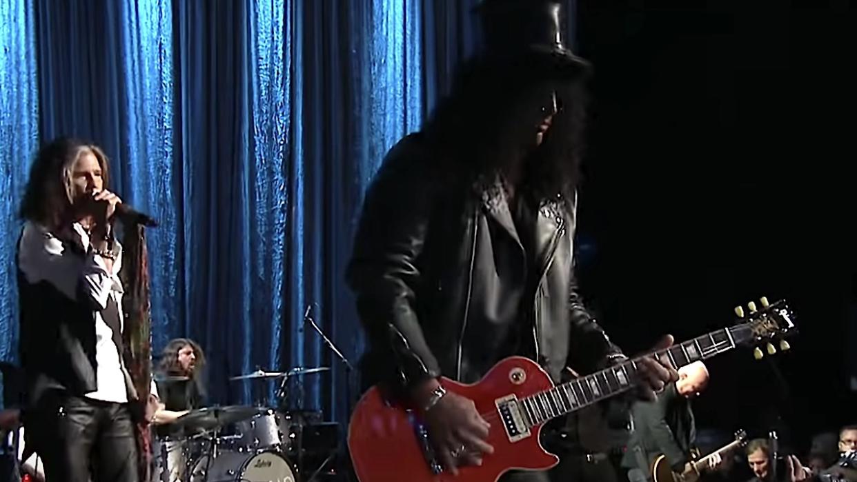  Steven Tyler, Dave Grohl and Slash onstage together in 2014. 