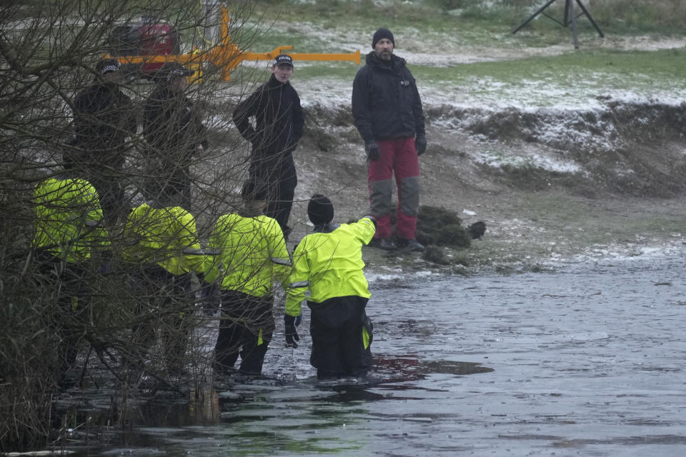 SOLIHULL, ENGLAND - DECEMBER 12: Emergency workers resume searches to determine if there was anyone else in the water on December 12, 2022 at Babbs Mill Park in Solihull, England. Four children were taken to hospital in critical condition after falling through an icy lake last night. The search continued for more potential victims, following reports more children were present on the ice at the time of the incident. (Photo by Christopher Furlong/Getty Images)