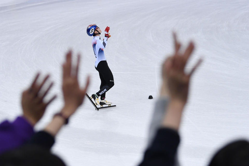South Korea's Lim Hyojun celebrates after the men's 5,000m relay short track speed skating heat event on Feb. 13, 2018. | Roberto Schmidt—AFP/Getty Images:
