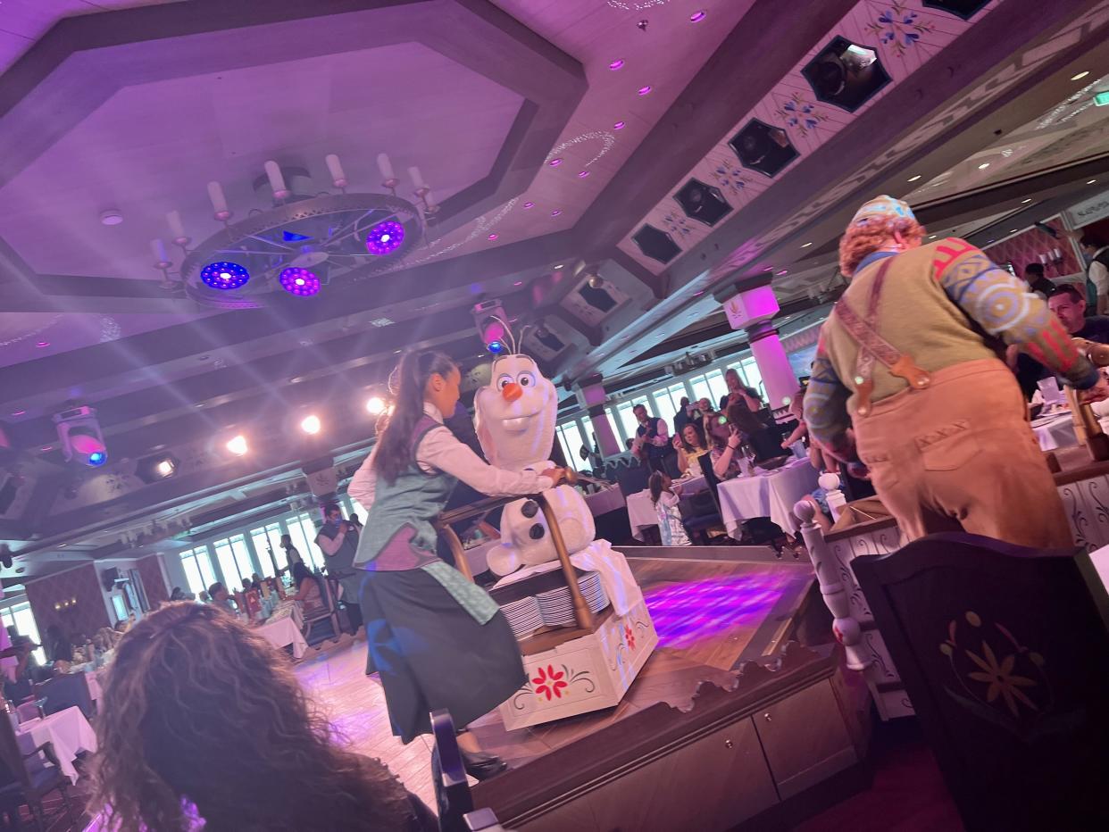 An animatronic Olaf visits tables and frequents the stage throughout the meal. (Photo: Terri Peters)