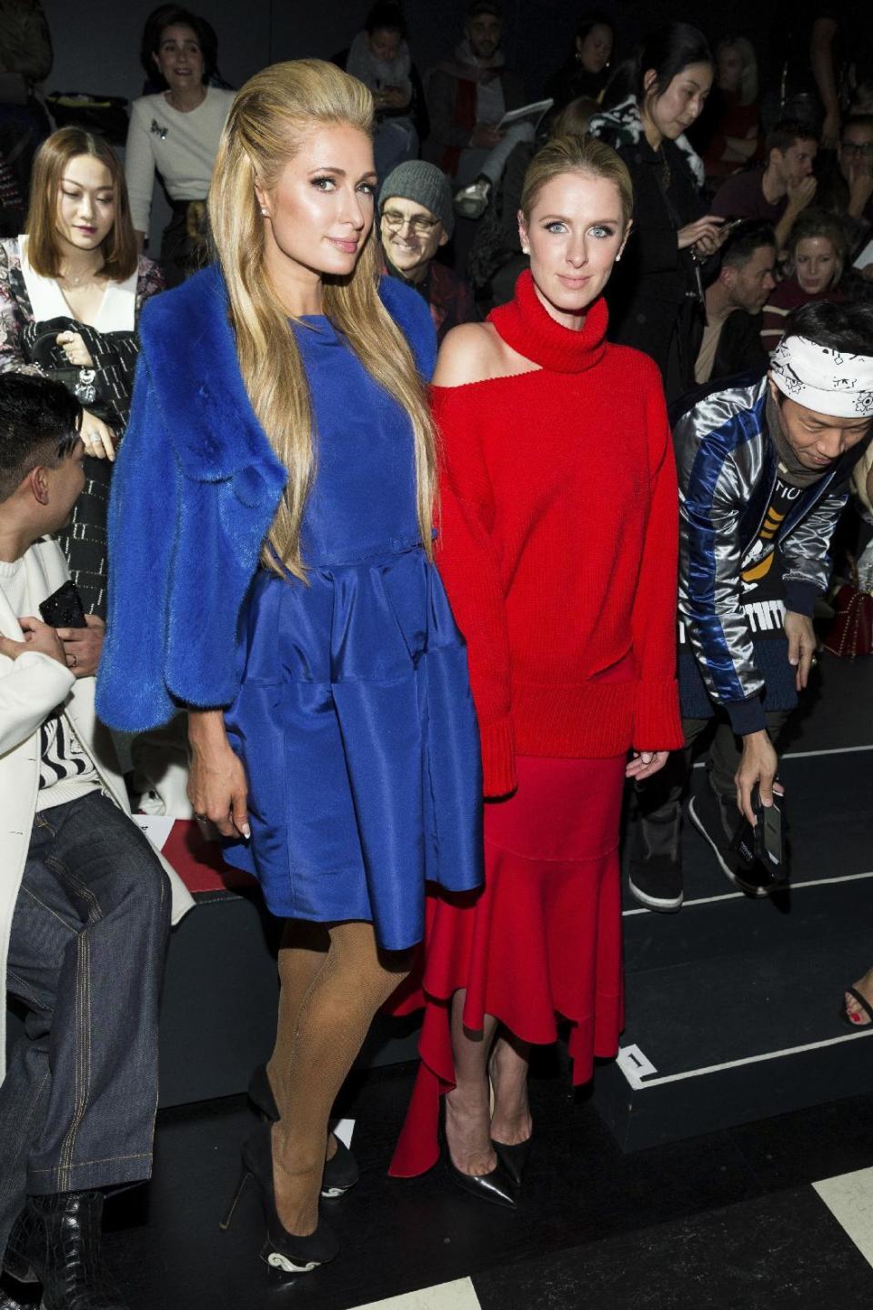 Paris Hilton, left, and Nicky Hilton Rothschild attend the Oscar De La Renta show as part of Fashion Week, Monday, Feb. 13, 2017, in New York. (Photo by Michael Zorn/Invision/AP)