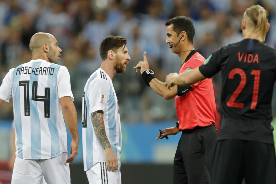 <p>I’m in charge: Lionel Messi gets a telling off from referee Ravshan Irmatov. (AP) </p>