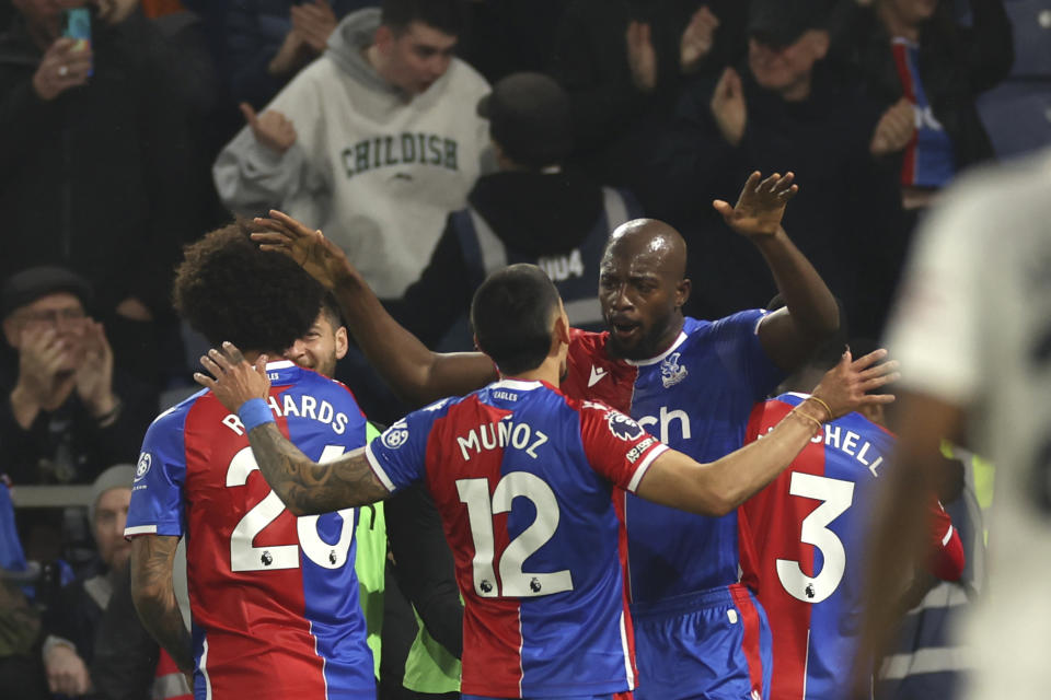 Crystal Palace's Jean-Philippe Mateta, right, celebrates with teammates after scoring his side's second goal during the English Premier League soccer match between Crystal Palace and Manchester United at Selhurst Park stadium in London, England, Monday, May 6, 2024. (AP Photo/Ian Walton)