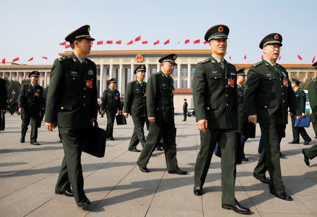 Military delegates leave the Great Hall of the People after a meeting ahead of National People's Congress (NPC), China's annual session of parliament, in Beijing, China March 4, 2019. REUTERS/Aly Song