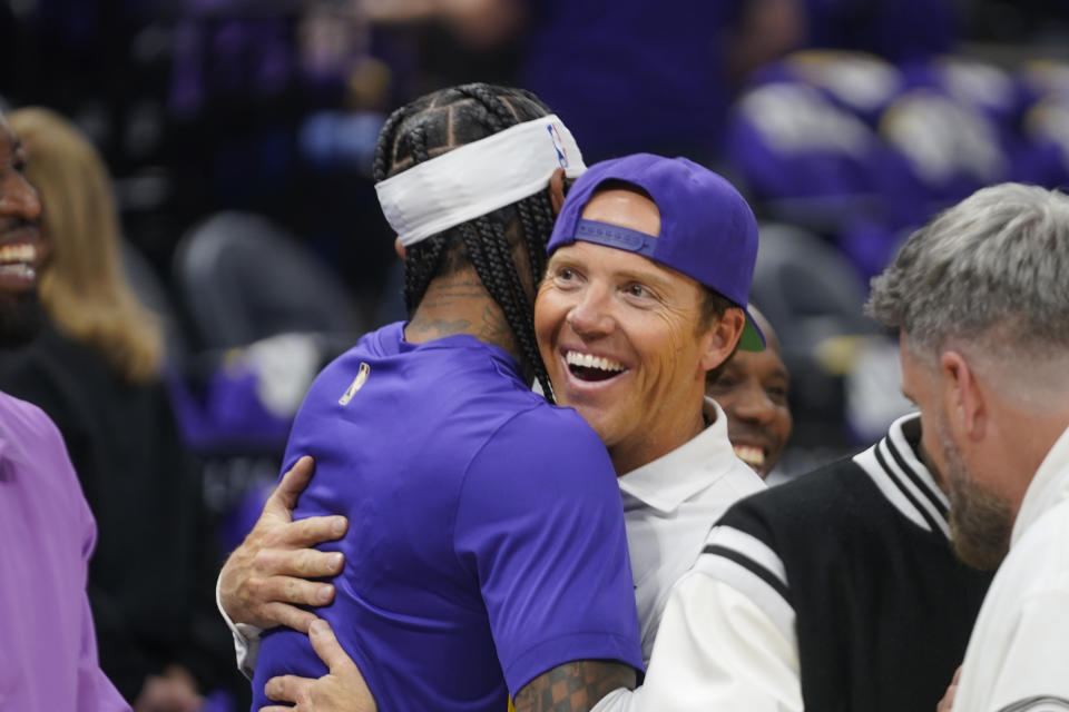 Utah Jazz owner Ryan Smith, right, hugs Utah Jazz guard Jordan Clarkson before the start of their NBA basketball game against the Sacramento Kings Wednesday, Oct. 25, 2023, in Salt Lake City. (AP Photo/Rick Bowmer)