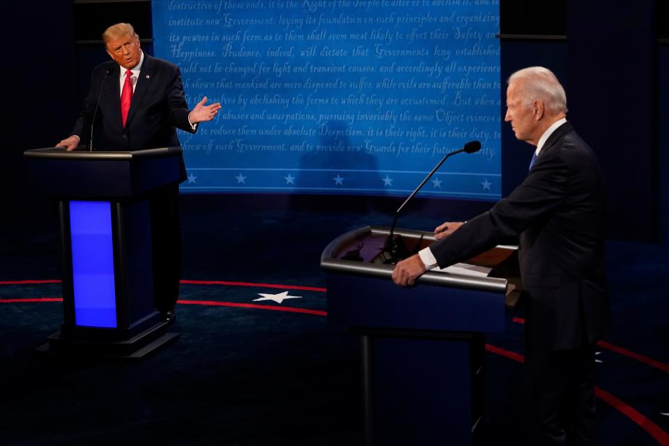 President Donald Trump gestures toward Democratic presidential candidate former Vice President Joe Biden.